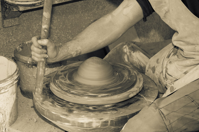 Wheel throwing clay, momentum wheel hand driven by broomstick