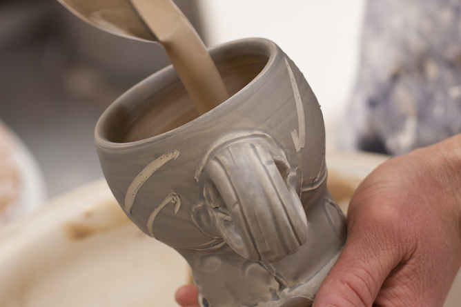 Glaze lining ladle pouring into mug